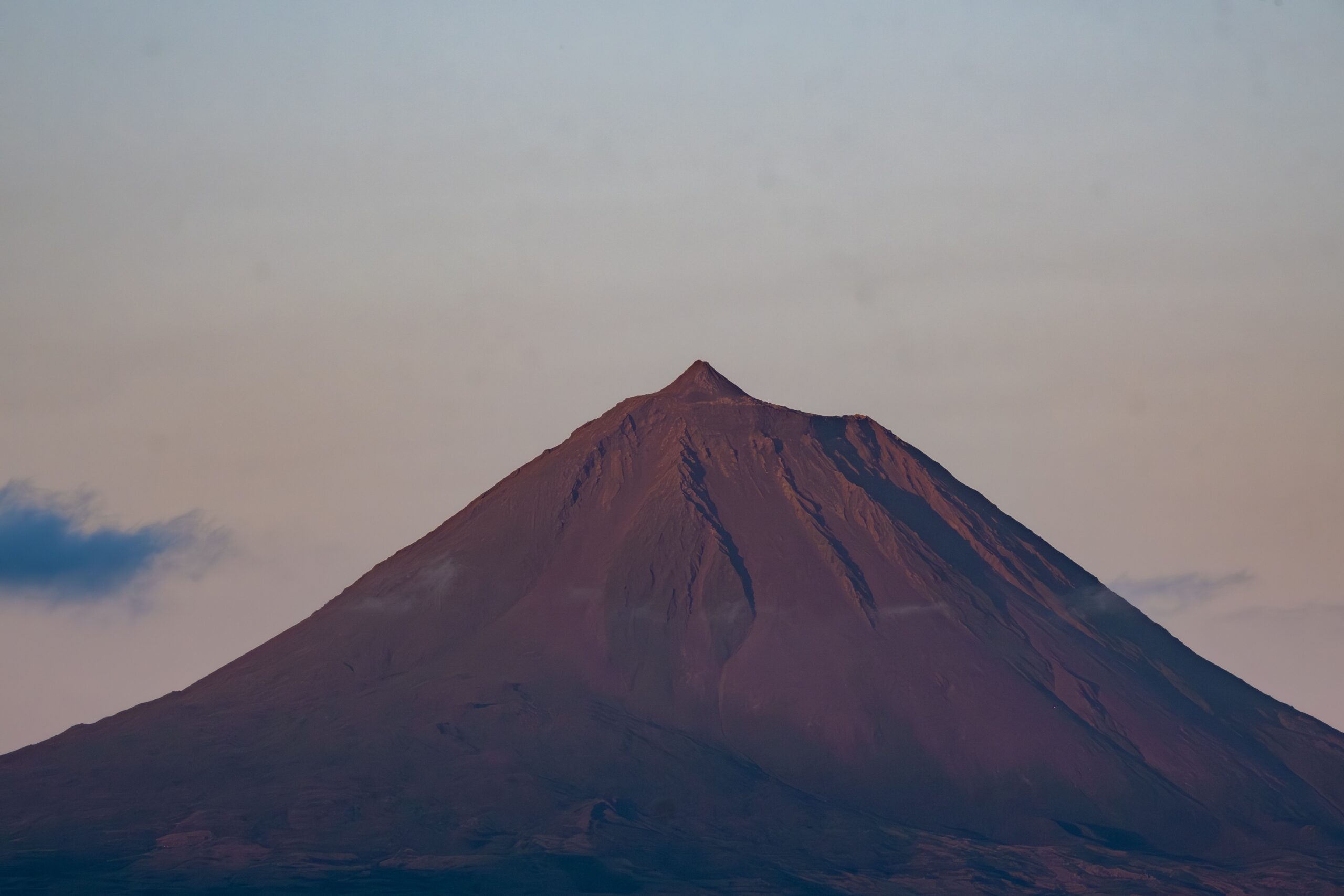Stunning view of Pico Mountain at sunset with a clear sky backdrop, capturing its natural beauty.